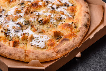 Creamy pizza with truffle cheese, mozzarella, chicken and mushrooms