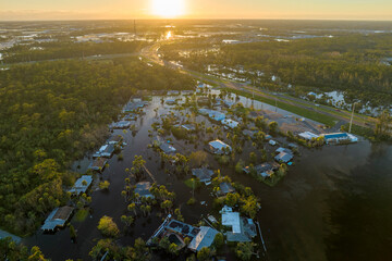 Flooded houses by hurricane Ian rainfall in Florida residential area. Consequences of natural...
