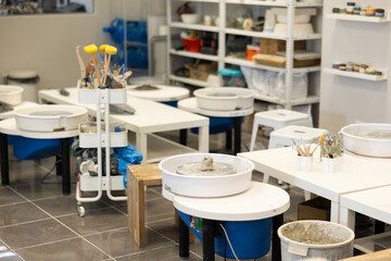 Pottery wheels and tables equipment for ceramic workshop
