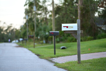 Typical american outdoors mail box on suburban street side