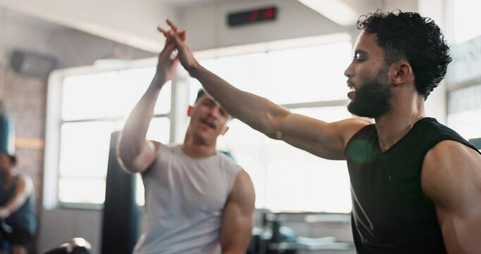 Men, high five and training on bike at gym with workout, support and tired with achievement for fitness. People, friends and cycling for cardio with celebration for speed, exercise and health at club