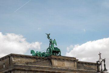 National symbol of Germany, famous landmark in Berlin, quadriga on Brandenburg Gate. Photo of ancient architecture, statue, sculpture. © shchus