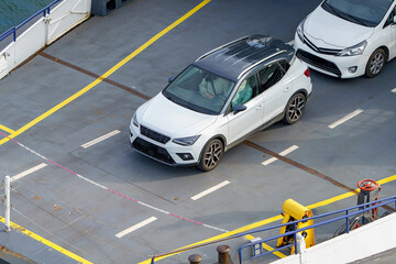 Car on a ferry for transporting vehicles on water.
