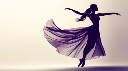 Silhouette of a ballerina in a flowing dress, dancing gracefully.