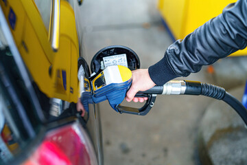Refueling a car at a petrol filling station.