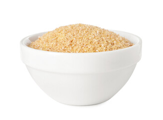 Raw wheat groats in bowl isolated on white