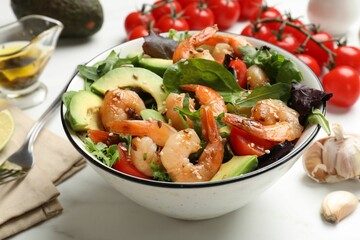 Delicious shrimp salad and ingredients on white table, closeup