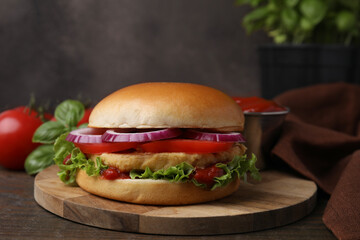 Delicious vegan burger with chickpea cutlet on wooden table