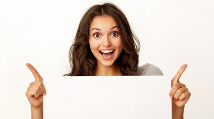 Fototapeta premium Cheerful Young Woman Pointing at Blank Sign
