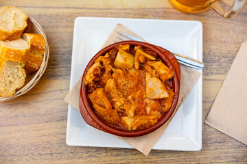 Portion of stewed tripe is cooked in plate - stomach of cattle. Traditional dish of Russian cuisine made from offal and offal of cow