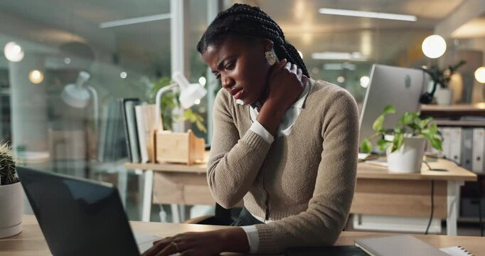 Black woman, night and laptop with neck pain for stress, injury or overworked at office desk. Young African, female person or employee working late with spasm, ache or fatigue for pressure or strain