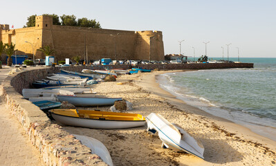 Mediterranean sea and outer stone wall of fort surrounding old medina of Hammamet, Tunisia. Africa