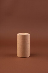 Minimalist Still Life with Books and Cardboard Tube Neutral Tones. minimalist composition featuring a stack of books in neutral colors with a cardboard tube on top, set against . High quality photo