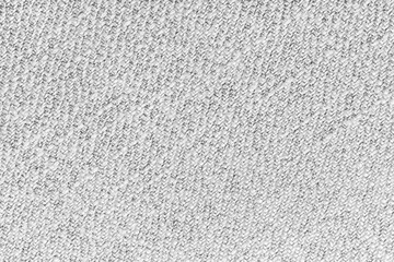 White Jacquard fabric with diagonal woven, coarse weave texture upholstery cloth. Textile background, furniture textile material, wallpaper, backdrop. Cloth structure close up, macro.