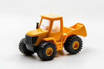 Isolated plastic construction vehicle toy against a white background