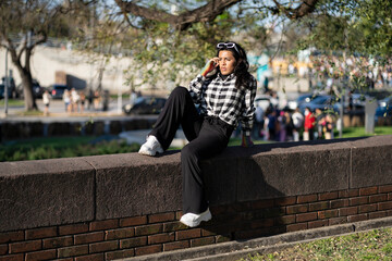 Fototapeta premium Transgender woman posing sensually in the park