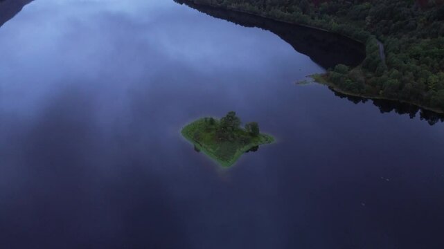 Beautiful drone clip of Loch Leven, Scotland, early in the morning, with a nice fog trapped in the valley.