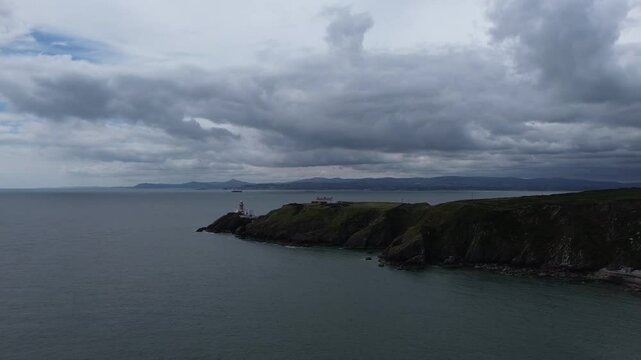 Coastal drone video of a part of Howth Head, a peninsula located northeast of the city of Dublin, Ireland. Here lies Howth's main lighthouse