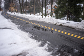 county road with snow and ice in winter