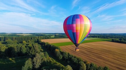 Fototapeta premium Colorful Hot Air Balloon Over Scenic Countryside View