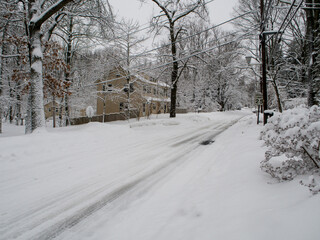 county road covered with snow during the snow storm	
