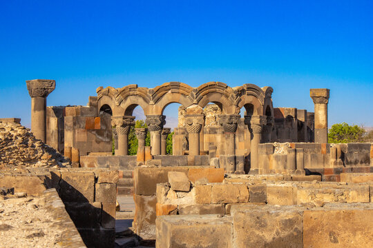 Columns and unique stone ruins of the ancient medieval Zvartnots temple. Vagharshapat Famous landmark constructed in the 7-th century in Armenia. Museum and archaeological site. Yerevan. Europe.