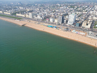 Aerial View of British Tourist Attraction of Beach and Ocean at Brighton and Hove Coastal City of England United Kingdom. High angle Footage of British Tourist Attraction Was Captured on May 9th, 2024