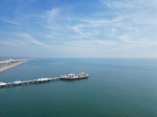 Aerial View of British Tourist Attraction of Beach and Ocean at Brighton and Hove Coastal City of England United Kingdom. High angle Footage of British Tourist Attraction Was Captured on May 9th, 2024