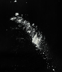 White snow falling down on black background