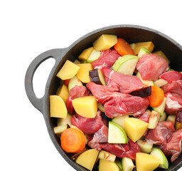 Cooking stew. Uncooked meat and vegetables in pot isolated on white, top view