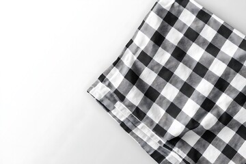 a black and white plaid towel with a white background.