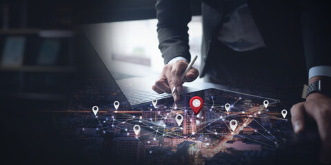 Businessman using internet network on digital tablet computer searching location target by GPS...
