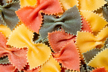 Uncooked Vibrant Colored Farfalle Pasta: A Culinary Canvas of Multicolored Bow-Tie Macaroni,...