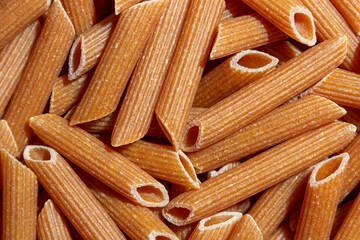 Uncooked Whole Grain Penne Rigate Pasta: A Culinary Canvas of Whole Wheat Macaroni, Creating a...