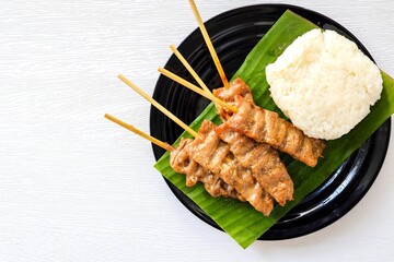 Thai-Styled BBQ Pork with Sticky Rice ,Thai call Moo ping,Sticky rice with grilled pork, top view...