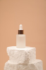 Frosted Glass Dropper Bottles with Natural Stone Aesthetic on Neutral Beige Background