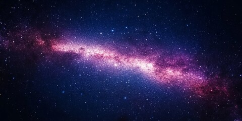 Fototapeta premium A wide-angle view of the Milky Way galaxy, filled with stars, glowing gas clouds, and interstellar dust