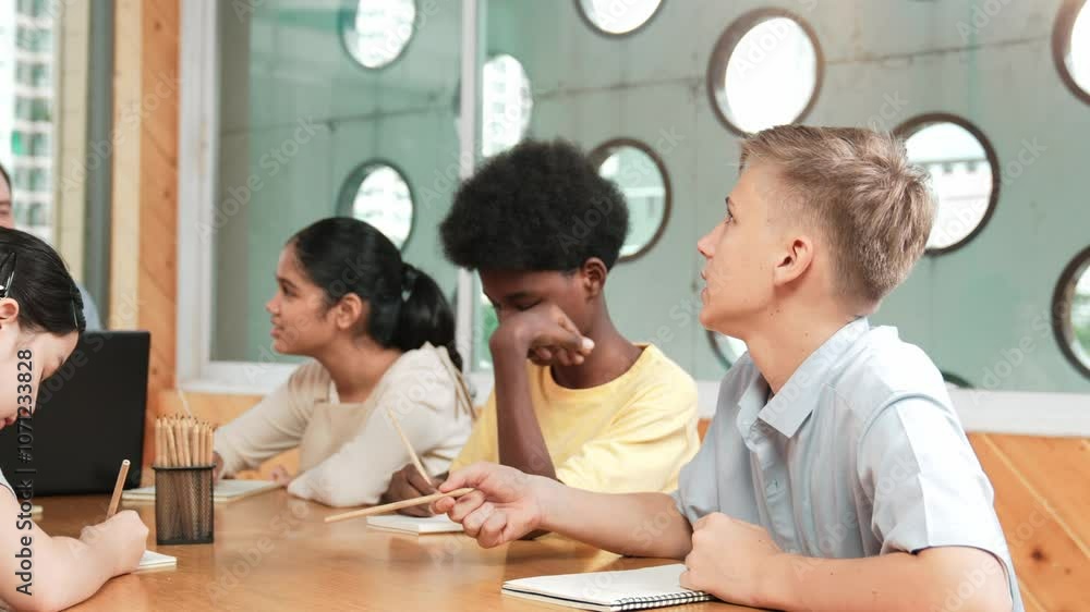 Poster smart boy listening teacher explain while lecturing and think about idea. diverse student study or l