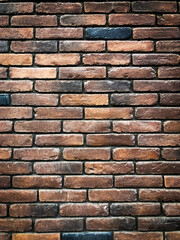 Background of brown vintage brickwork with light vignetting