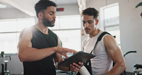 Workout, tablet and personal trainer with people in gym for training, exercise schedule and fitness. Bodybuilder, strong and sports athlete with person and planning for energy, wellness and team