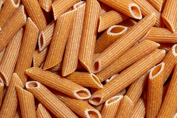 Uncooked Whole Grain Penne Rigate Pasta: A Culinary Canvas of Whole Wheat Macaroni, Creating a...