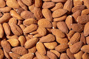 Scattered Almonds. Background from Almond Nuts. Natural High-Calorie Snacks