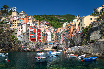 Harbour and colorful fisher houses of Riomaggiore at Cinque Terre, Liguria, Italy