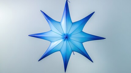 Obraz premium Inflatable 4-Sided Star with Gradient Blue Design on White Background