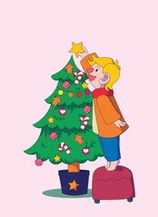 picture of a boy putting a star on a christmas tree. idea for greeting card.