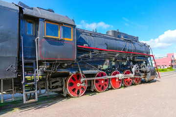 Vintage retro steam locomotive outdoors in the station