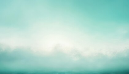 Obraz premium A Foggy Teal Sky With Sunlight Glowing Through Clouds