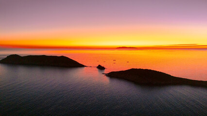 Last hours of light illuminate the small islands full of sahuaros in front of San Carlos Sonora,...