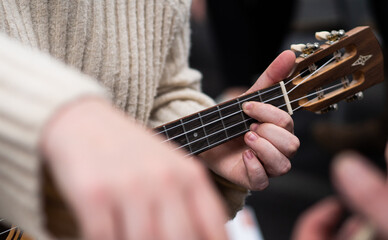 Fototapeta premium Ukulele playing close up hands people music