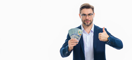 Man showing cash money in dollar banknotes. Portrait of business man isolated on white studio banner. Successful winner celebrating success or victory with money bills.
